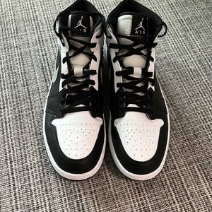 Like new Nike AirJordans. AJ 1 Mid.  Worn twice.. Color: black. gray & white.